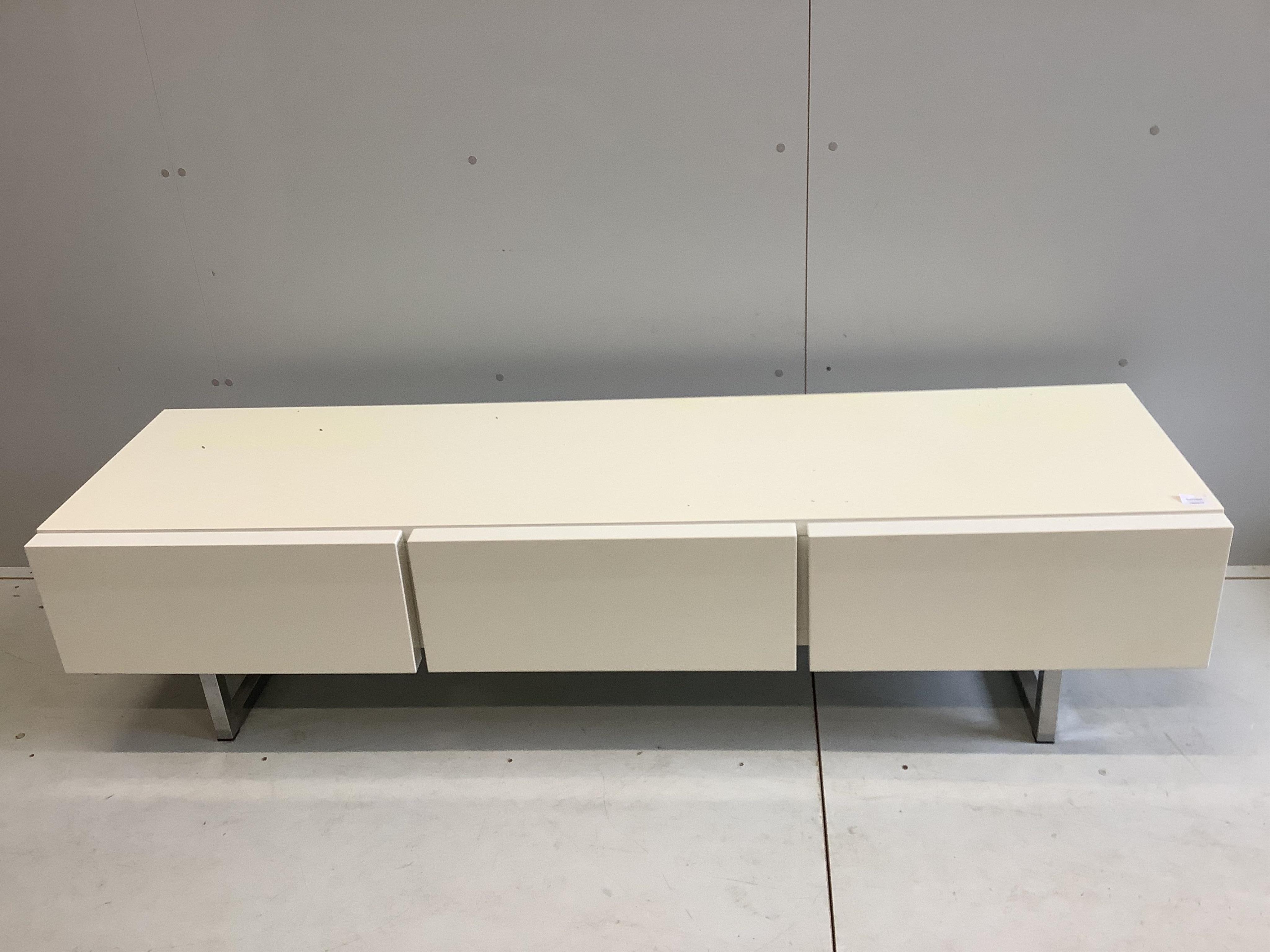 A Calligaris white low side unit, width 184cm, depth 52cm, height 45cm. Condition - good